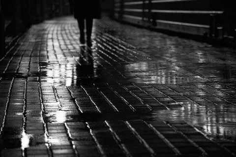 Passenger on an empty platform at night Stock Photos