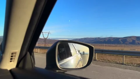 Passenger enjoys breathtaking views while driving on open highway Stock-Footage 337032367
