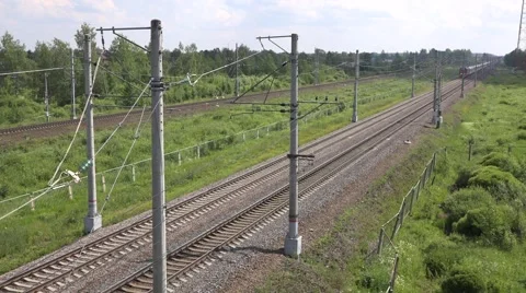 Passenger express train runs along the Moscow - Saint Petersburg main line Stock Footage 64943526