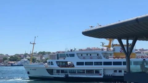 A passenger ferry docking at the pier in the Bosphorus Stock Footage 171932144