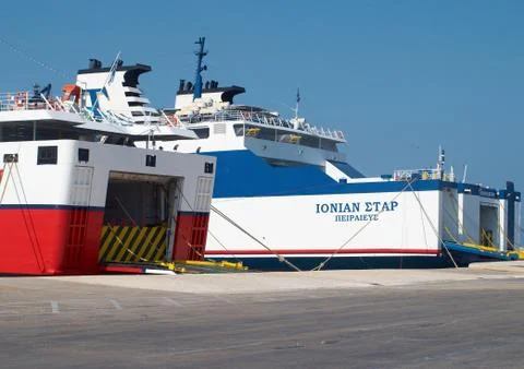 Passenger ferry in harbor with open back door Stock Photos