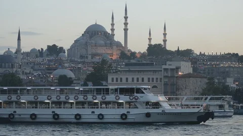 A passenger ferry sails across the frame with Golden Horn behind Stock Footage 91079367