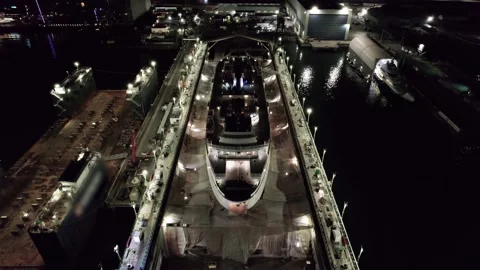 Passenger ferry undergoing maintenance on dry-dock, port, industrial. 4K 24FPS Stock Footage 220598773