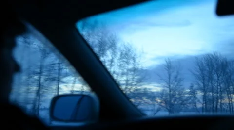 Passenger on a front seat into a car winter evening Stockbeeldmateriaal 44292425