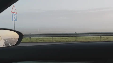The passenger gazes out the window while traveling on a foggy morning Video stock 347464992