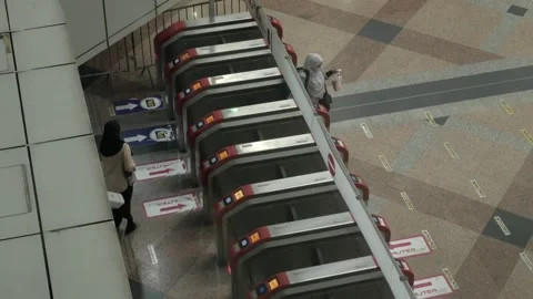 Passenger get through the ticket gate RFID card in rush hour in Kuala lumpu.. Stock Footage 255432864