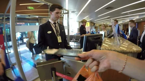 Passenger Giving Passport and Ticket for Boarding Pass in Airport Stock Footage