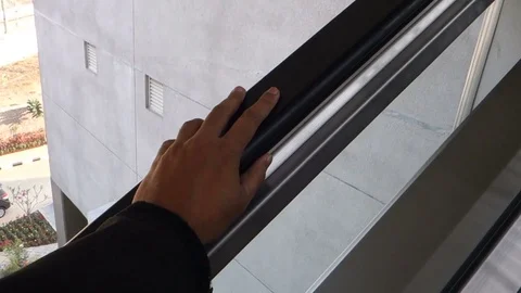 Passenger hand on the escalator Stock Footage 83192630