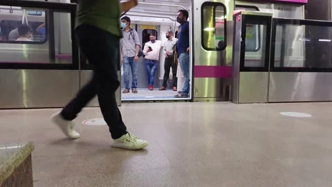 Passenger inside metro departing train with automatic closing gate at station Stock Footage 219442207