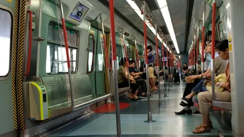 Passenger inside an MTR train on the East Rail Line Stock Footage 76596620