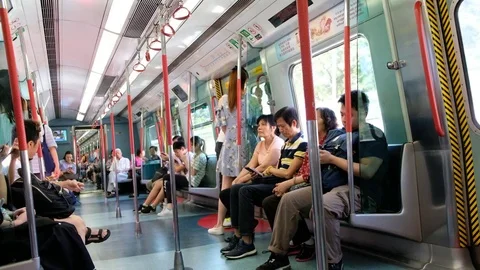 Passenger inside an MTR train on the East Rail Line Stock Footage 76596826