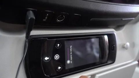 Passenger interacts with Airplane Entertainment System Remote Control 動画素材 94425457