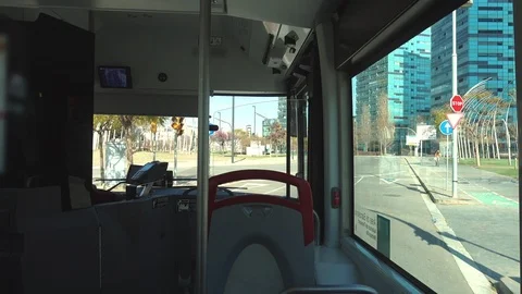 Passenger interior view, empty seats in a Barcelona public bus during the day Stock Footage 104763698