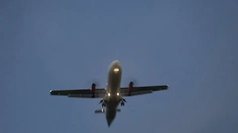 Passenger jet  flies straight over the road at very low altitude. Stock Footage 38286559
