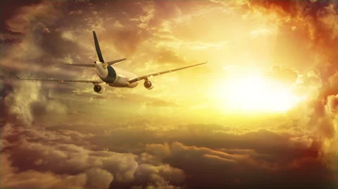 Passenger jet flying above the clouds towards the horizon. Sunset version. Stock-Footage 44564850