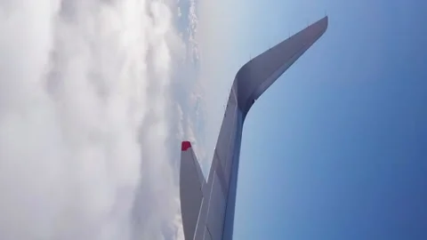 Passenger Jet Flying Above Clouds View from Porthole Stock Footage 237236591