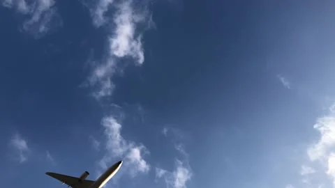Passenger jet passing overhead at low altitude. Stock Footage 166825859