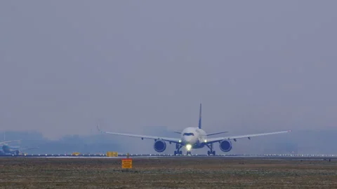 Passenger Jet Takeoff on a Hazy Morning Stock Footage 332411853