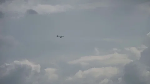 Passenger Jumbo Jetliner Jet Flying Through Clouds At Airport Stock Footage 80749161