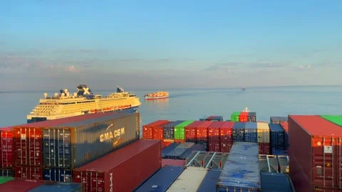 Passenger liner Celebrity SUMMIT overtaking container vessel Stock Footage 242827693