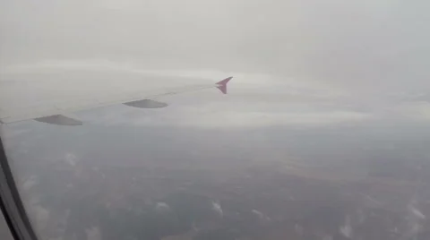 Passenger liner flying through clouds, airplane flight porthole, click for HD Stock Footage 43965967