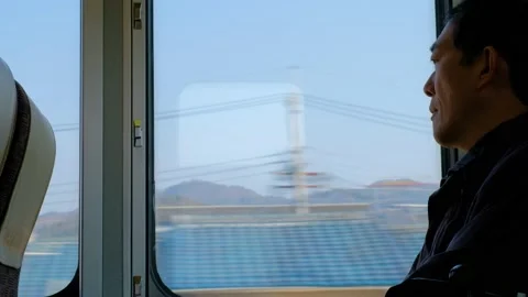 Passenger looking out of train window Stock Footage 132014263