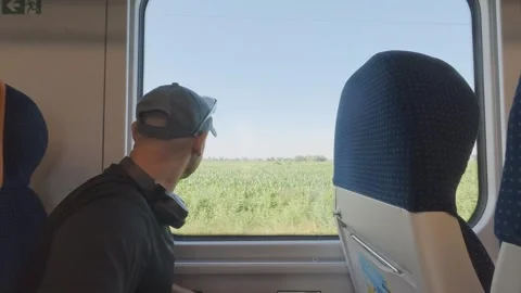 Passenger Looking Through Train Window During a Railway Journey in Poland Stock Footage 340019853