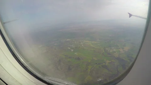 Passenger looking through window of plane shaking in turbulence. Air disaster Video stock 87322765