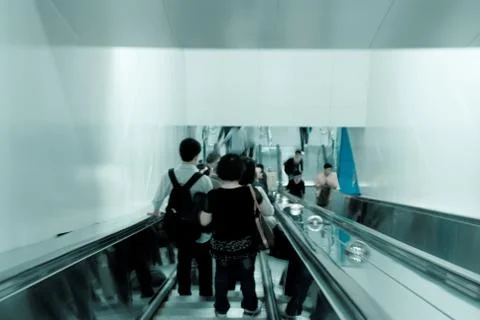 Passenger on moving escalator Foto stock