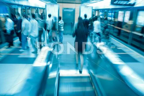 Passenger on moving escalator Stock Photos