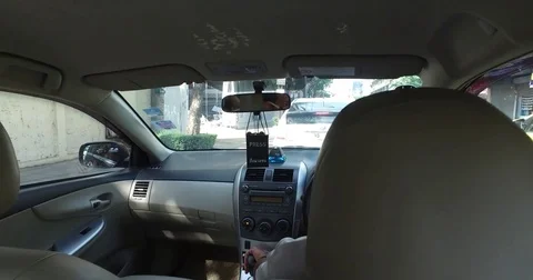 Passenger pan down angle from car backseat Stock Footage 72266019