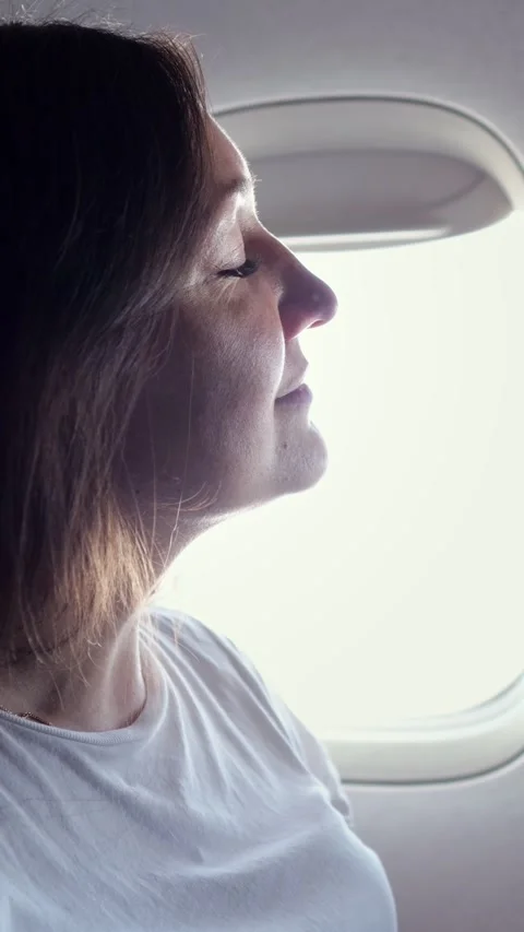 Passenger Peacefully Admiring Sky View. Female Passenger Immersed In Thoughts 스톡 동영상 332644413
