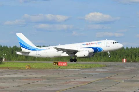 The passenger plane accelerates on a runway Stock Photos