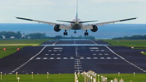 Passenger plane background sea Heading to coast for landing, aerial view. White Stock Footage 196910447