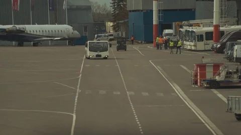 A passenger plane being serviced by ground services before next takeoff. Stock-Footage 76204156