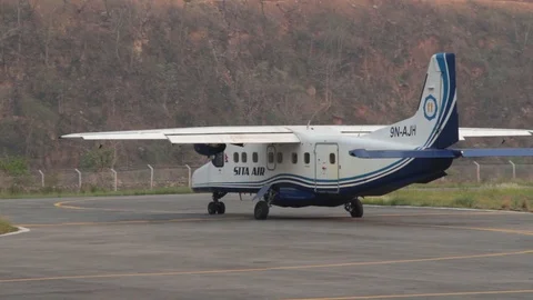 Passenger plane drives onto the runway of the Ramechhap in Himalayas Stock Footage 125388865