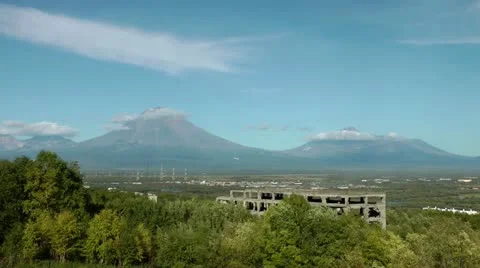 The passenger plane flew up and flew by against a huge volcano Stock Footage 12314596