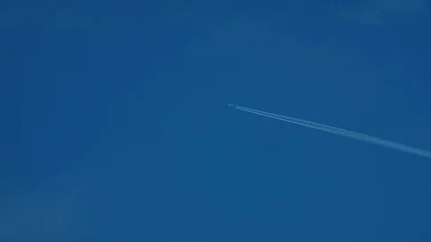 Passenger Plane Flies in the Clear Sky Leaving behind a Smoke Trail Stock Footage 109212641