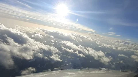 Passenger plane flies over white clouds. Stock Footage 141369424