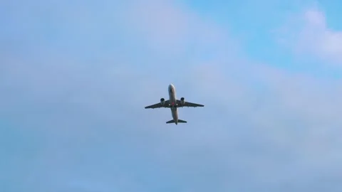 Passenger plane flies in sky, view from below. Airplane travel concept Stock Footage 231167643
