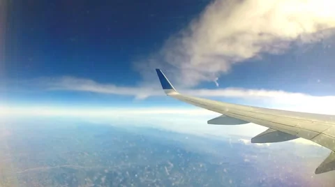 Passenger plane flies through the fluffy clouds POV Stock Footage 52935483
