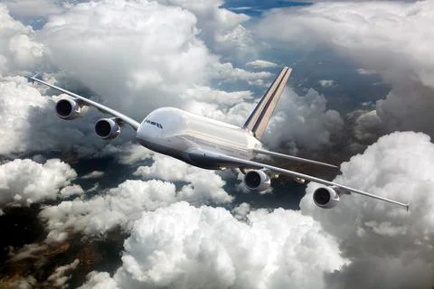 Passenger plane in flight. Front view. Right heeling. Stock Photos