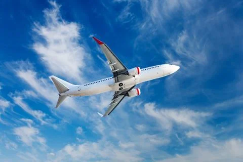 The passenger plane in flight. Stock Photos