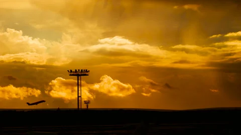 Passenger plane fly up over take-off runway from airport at sunset Stock Footage 63647475