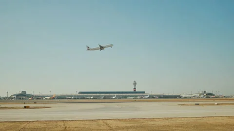 Passenger plane fly up over take-off runway from airport. Stock Footage