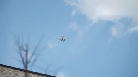 Passenger plane flying in the clouds 스톡 동영상 196865579