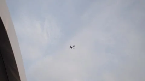 A passenger plane is flying high in the sky Stock Footage 138583656