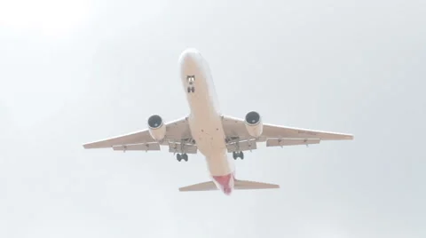 Passenger plane flying overhead Stock Footage 47890984