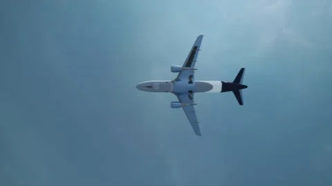 Passenger plane flying overhead. View from below of the flying plane Stock Footage 233495850