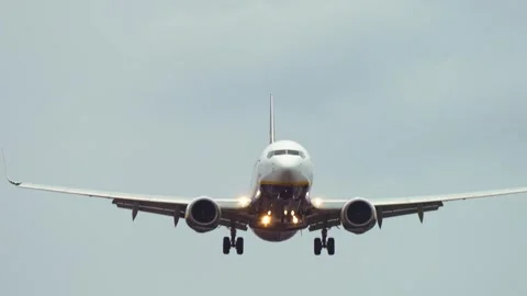 Passenger plane gently landing in cloudy weather. Aircraft smoothly descending Stock Footage 318453432